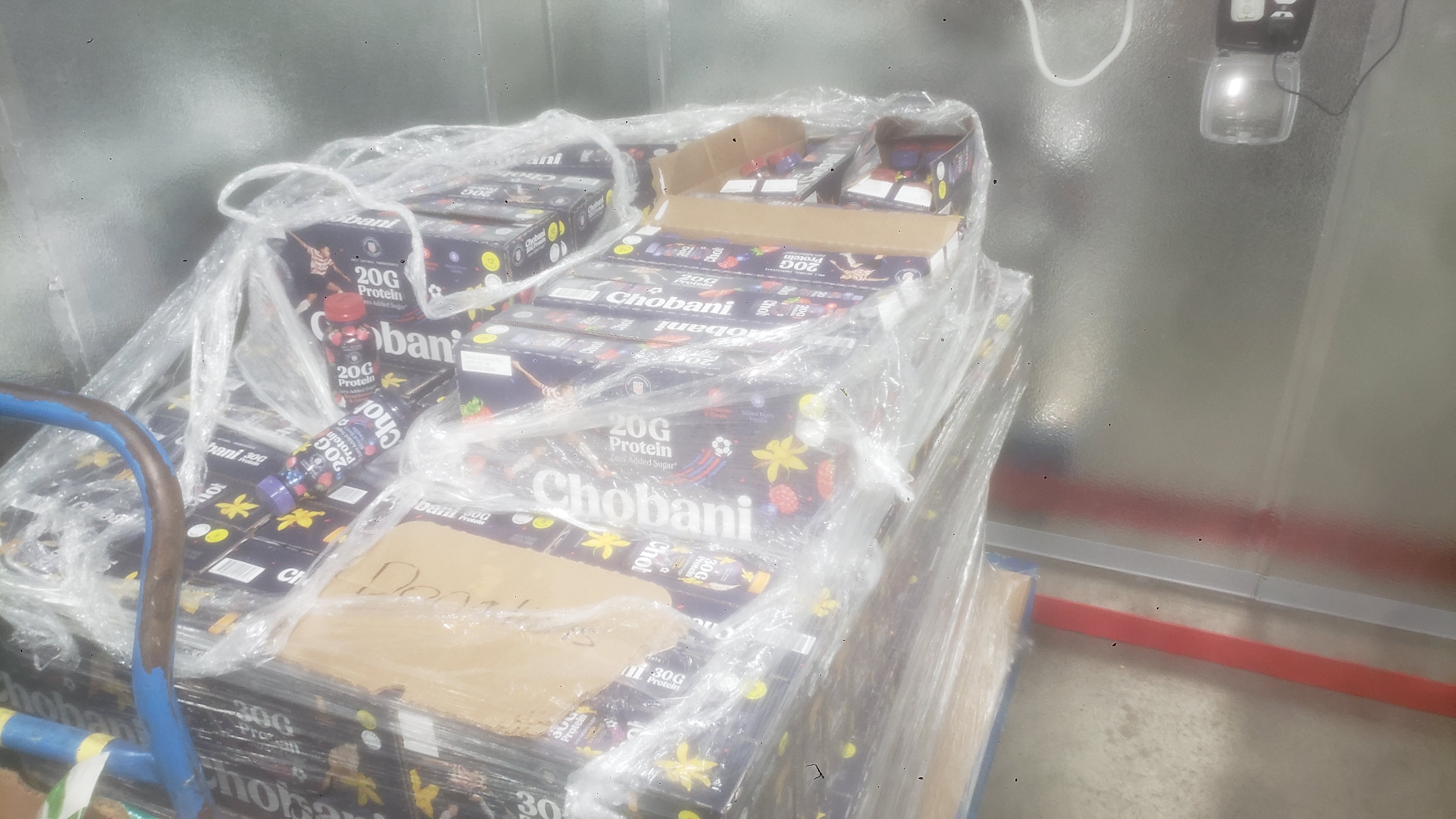 Boxes of greek yogurt protein drinks on a pallet.